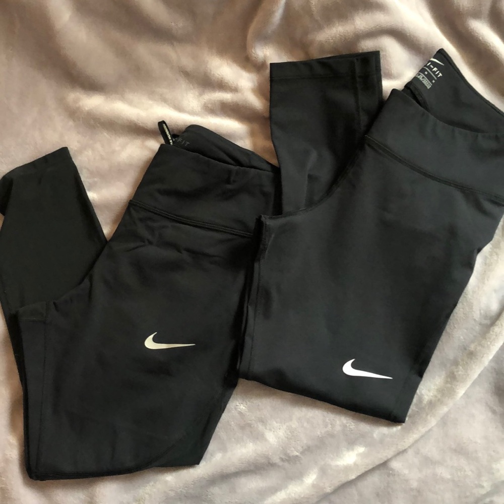 Two pairs of black Nike leggings